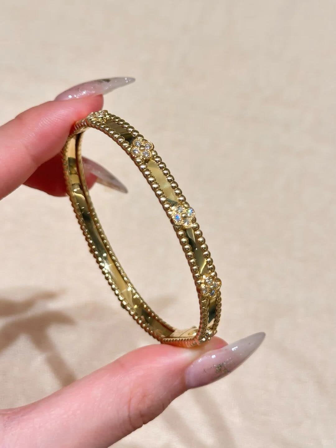 Van Cleef & Arpels Elegant Gold and Silver Bracelets Set